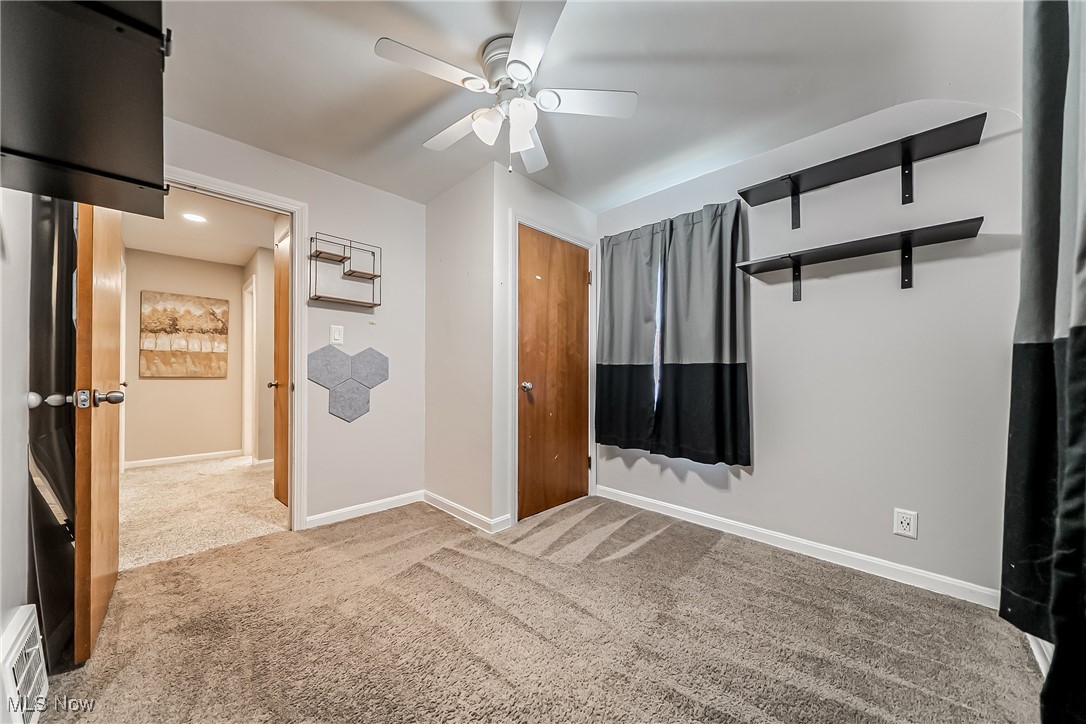1235 Dorsh Road Cleveland, OH 44121 - Photo 15 of 39 Unfurnished bedroom with carpet, ceiling fan