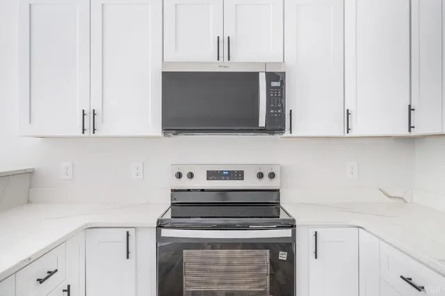 a kitchen with a sink and a window