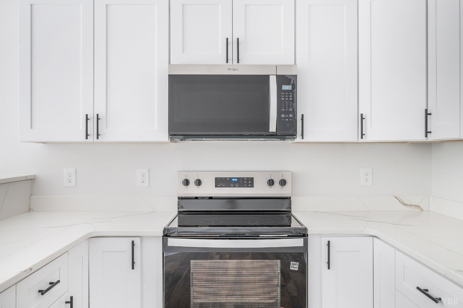 451 Dearborn Road Evington, VA 24550 - Photo 14 of 45 a kitchen with stainless steel appliances granite countertop white cabinets a stove top oven