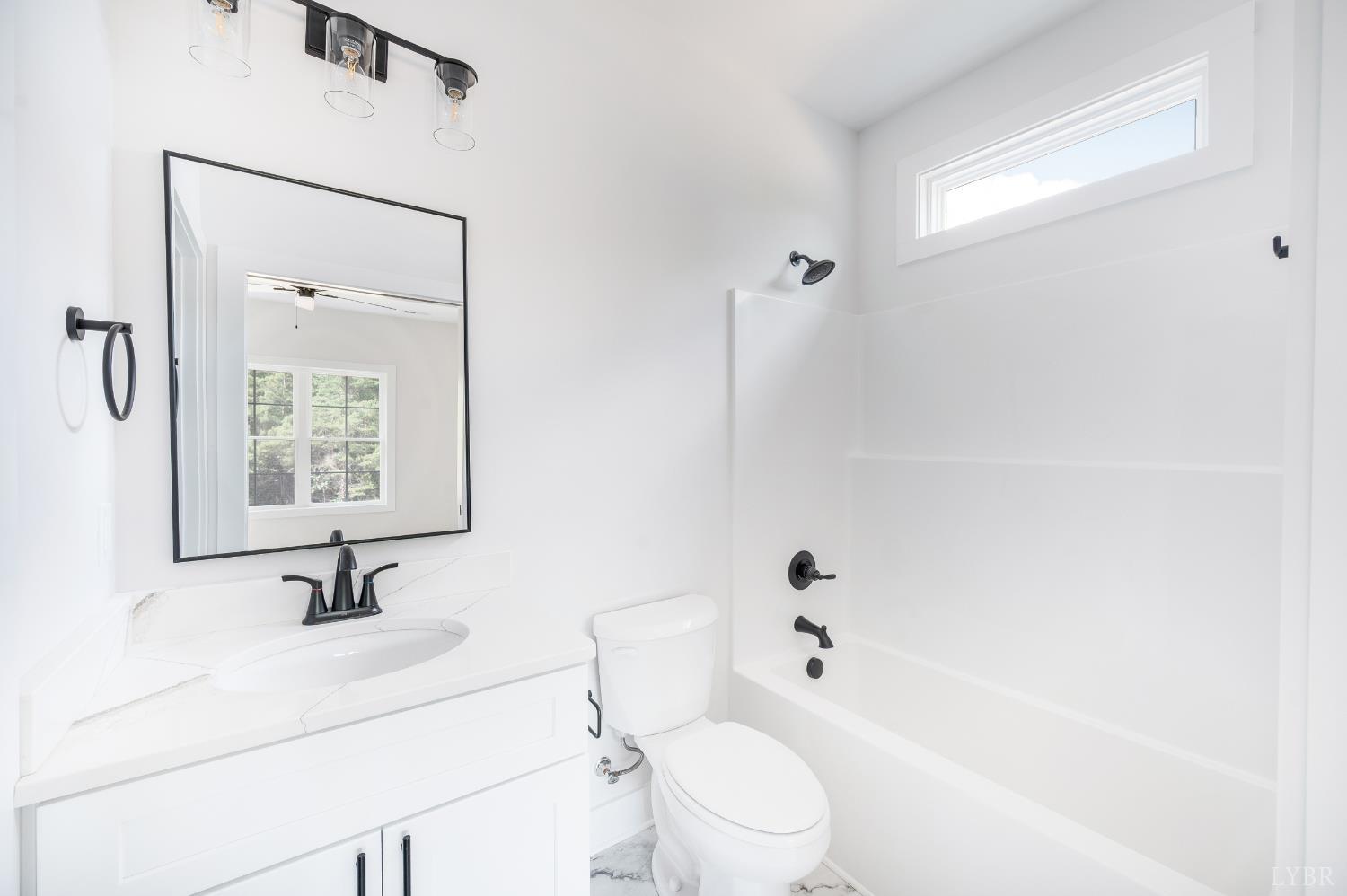 451 Dearborn Road Evington, VA 24550 - Photo 23 of 45 a bathroom with a sink a toilet and shower