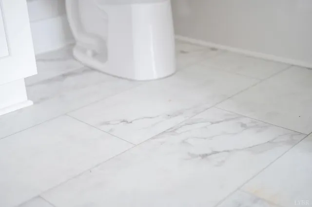 a picture of a bathroom with a shower