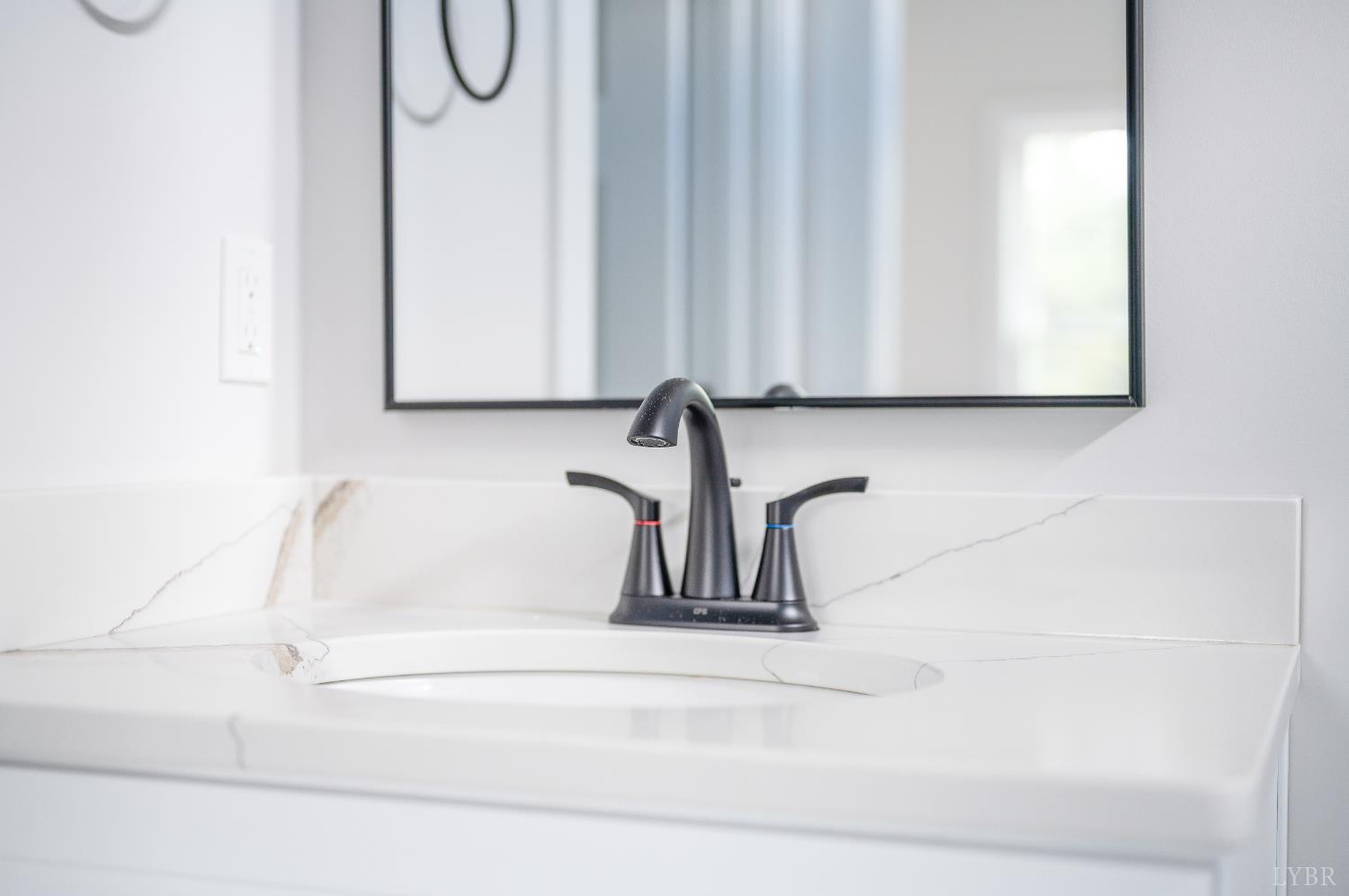 451 Dearborn Road Evington, VA 24550 - Photo 26 of 45 a bathroom with a white sink and a window