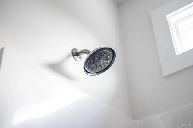 a bathroom with a shower and a sink