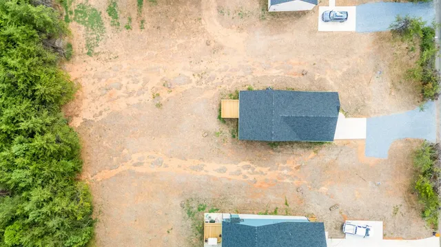 a view of a lake with green field