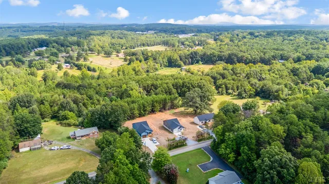a view of a garden with a building in the background