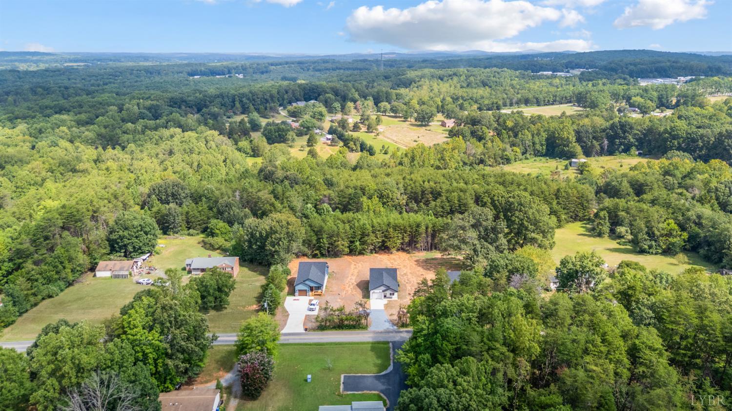 451 Dearborn Road Evington, VA 24550 - Photo 40 of 45 an aerial view of residential houses with outdoor space and trees