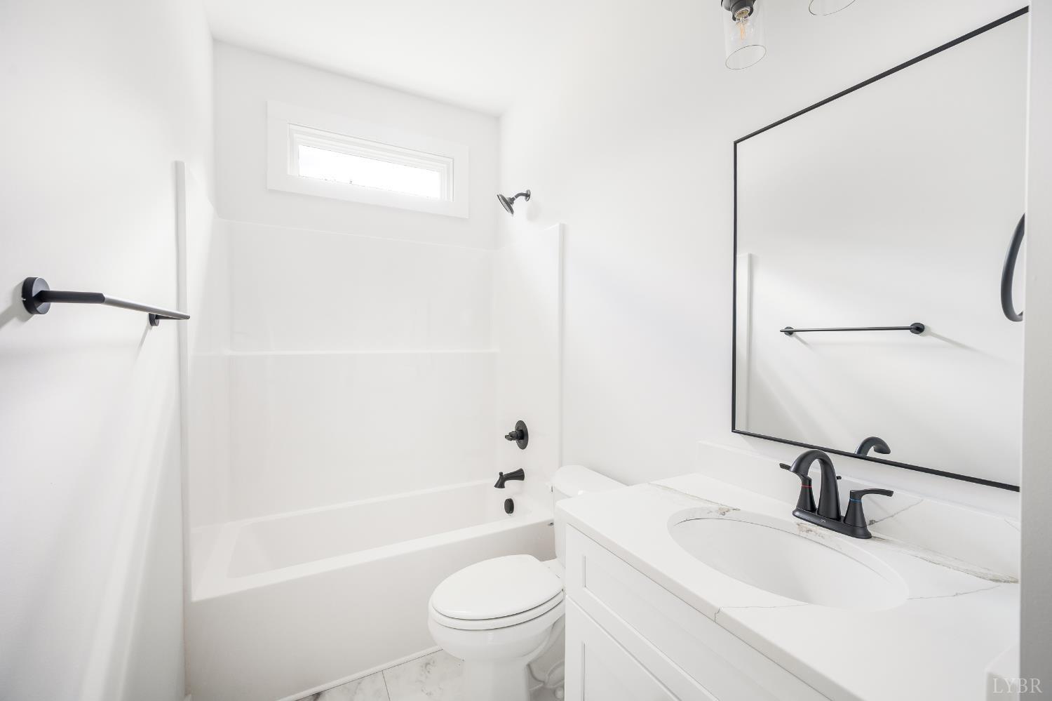 451 Dearborn Road Evington, VA 24550 - Photo 10 of 45 a bathroom with a sink a toilet and a bathtub