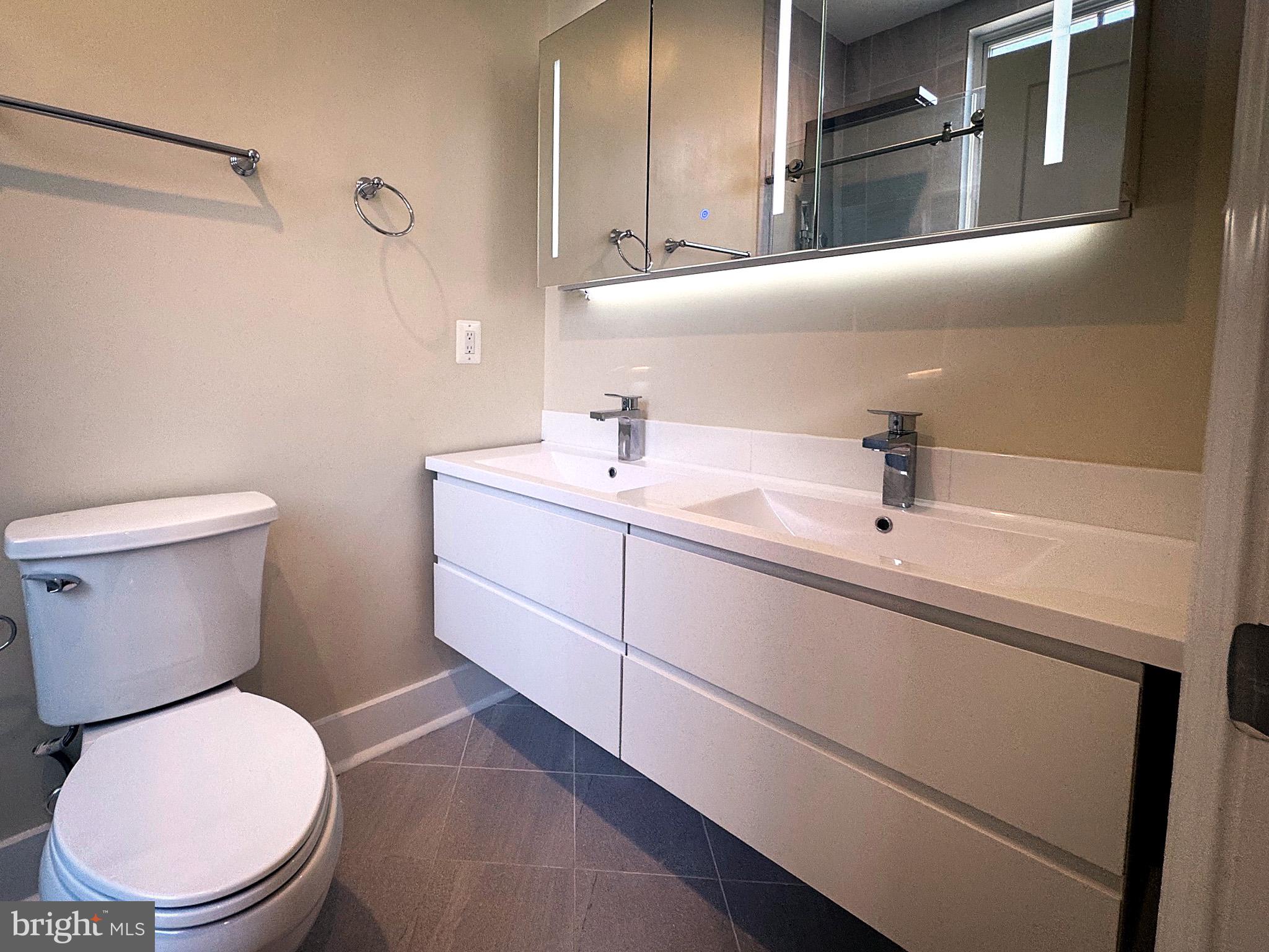 625 Park Road Northwest Washington, DC 20010 - Photo 14 of 22 Sleek modern bathroom with elegance.