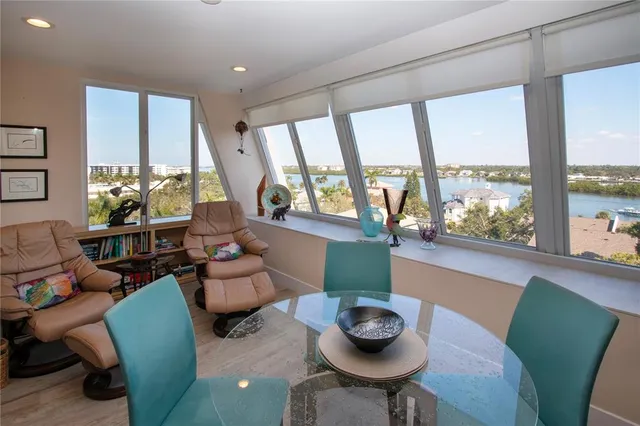 a large bed sitting in a bedroom and a chandelier