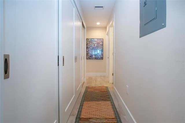 a view of a livingroom with workspace and a window