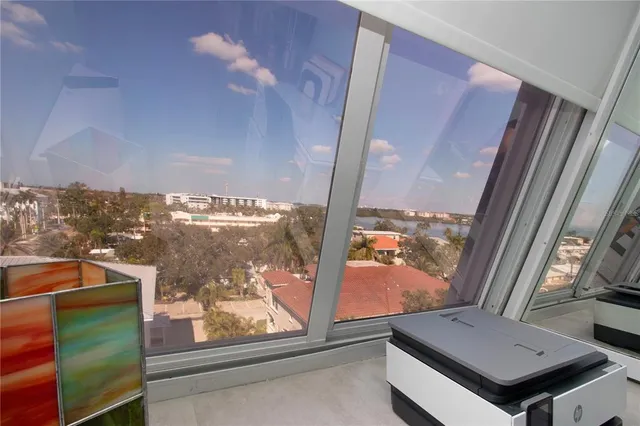 a bathroom with a granite countertop sink a toilet a mirror and shower