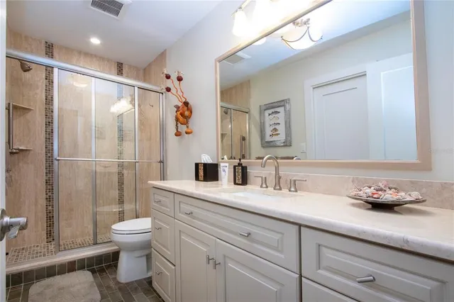 a view of a patio with chairs and tables