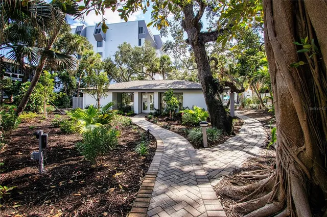a view of a swimming pool with an outdoor seating