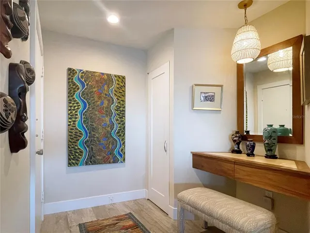 a kitchen with a refrigerator and a sink