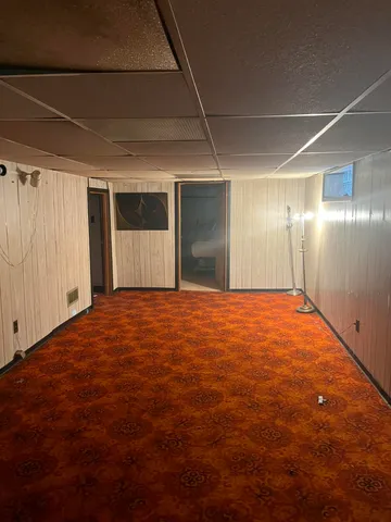 a bedroom with a bed and a night stand