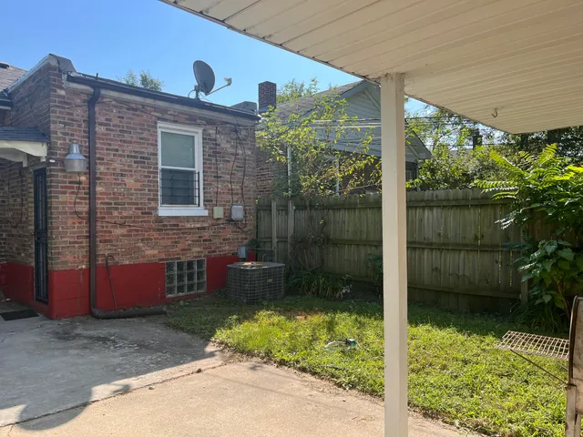 a bathroom with a toilet a sink and a window