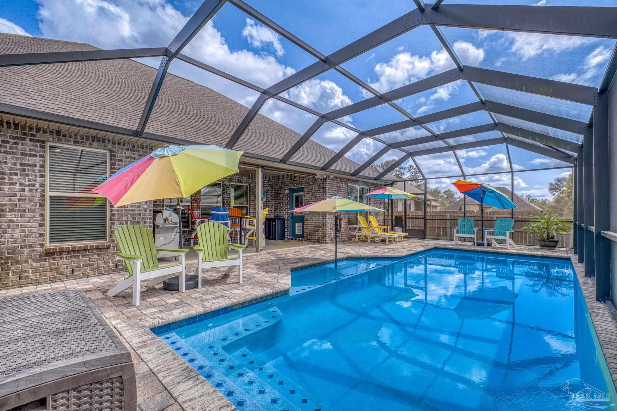 a view of a swimming pool with a patio