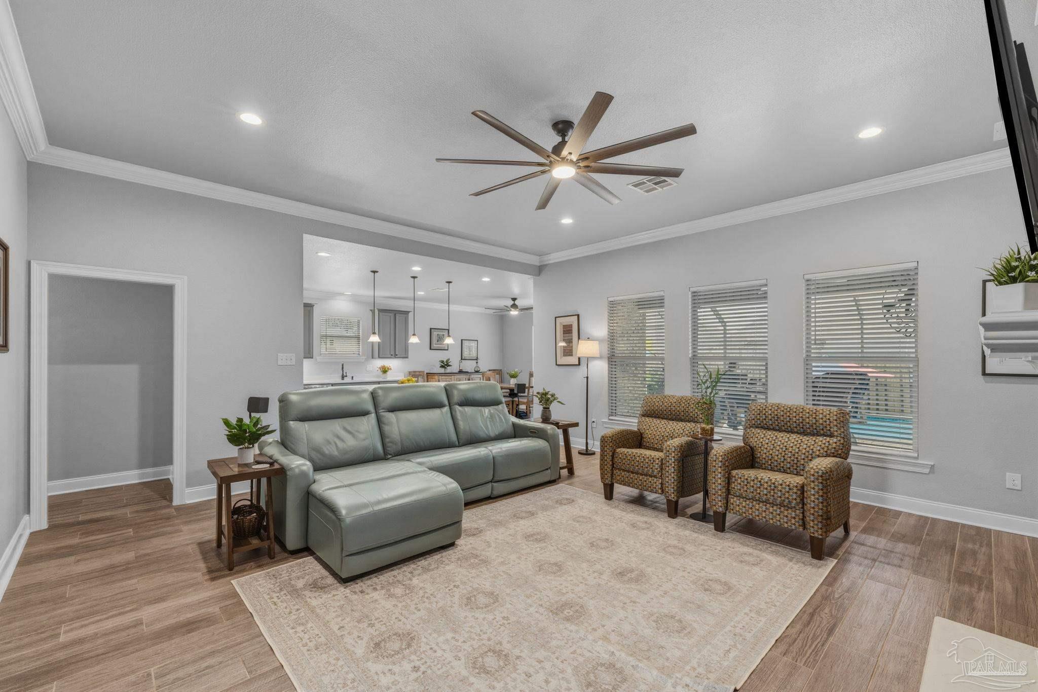 2129 Eagles Rdg Cove Cantonment, FL 32533 - Photo 15 of 66 a living room with furniture and a wooden floor