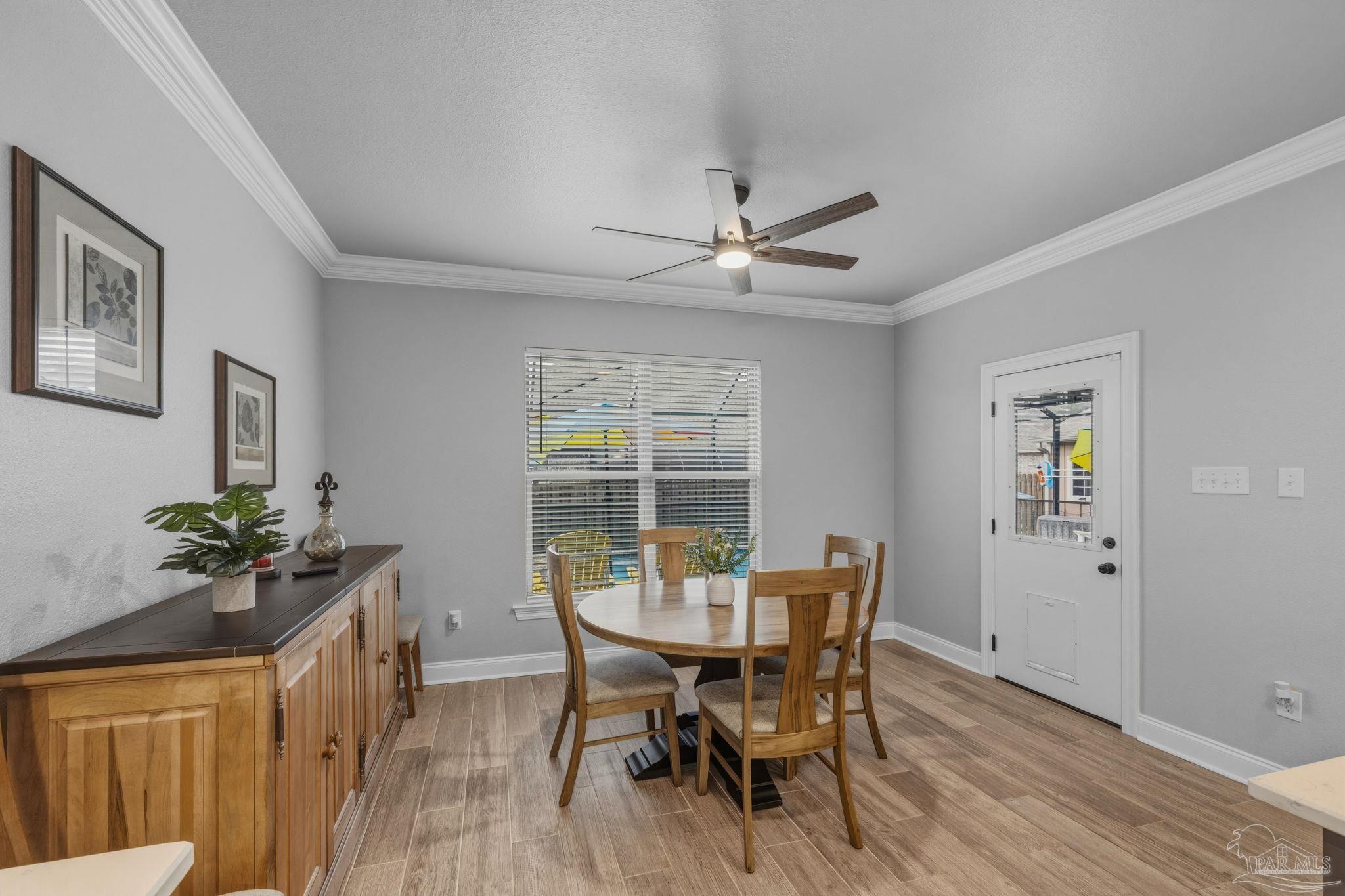 2129 Eagles Rdg Cove Cantonment, FL 32533 - Photo 26 of 66 a view of a dining room with furniture and window