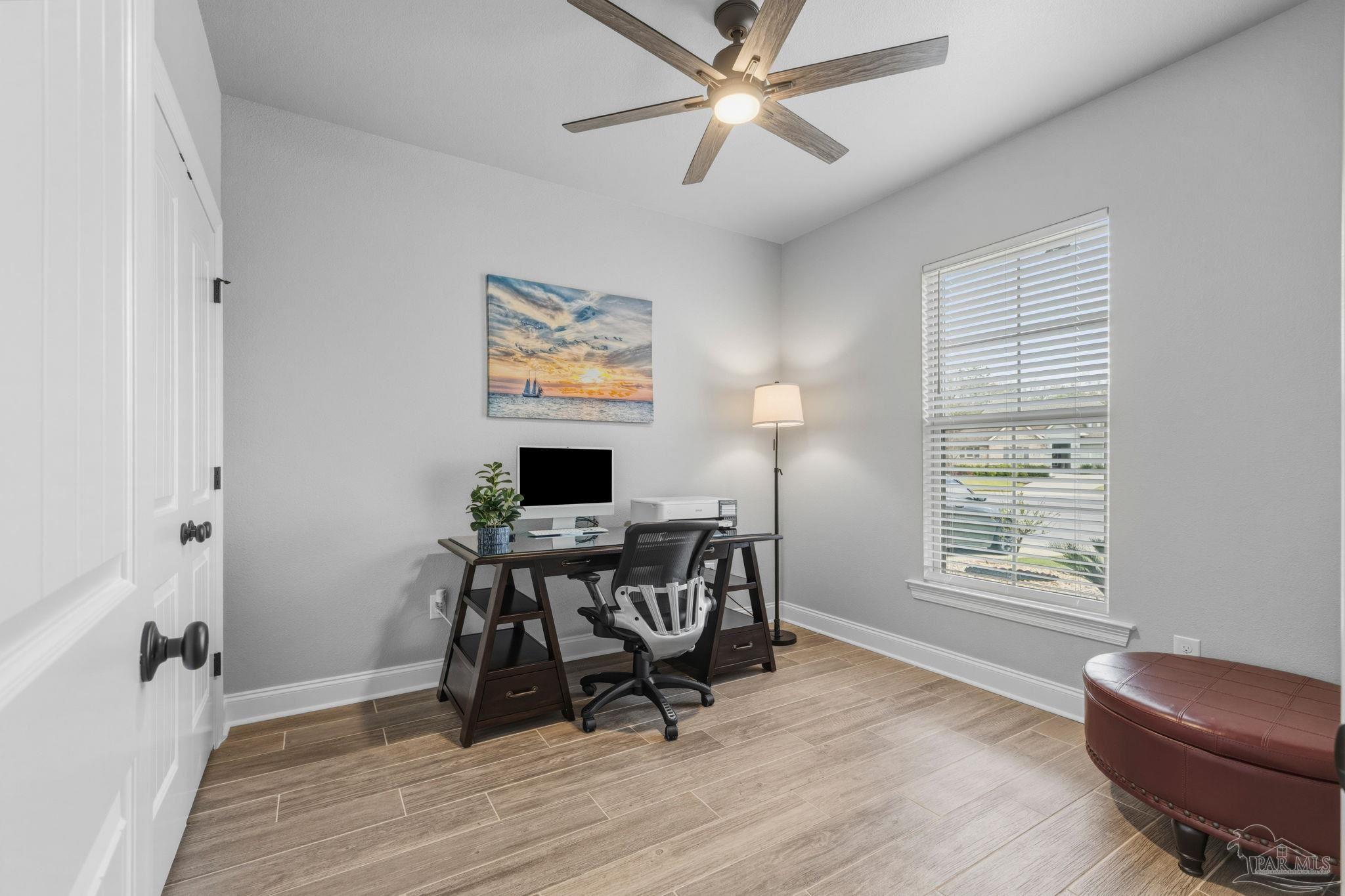 2129 Eagles Rdg Cove Cantonment, FL 32533 - Photo 30 of 66 a view of a workspace with furniture and a window