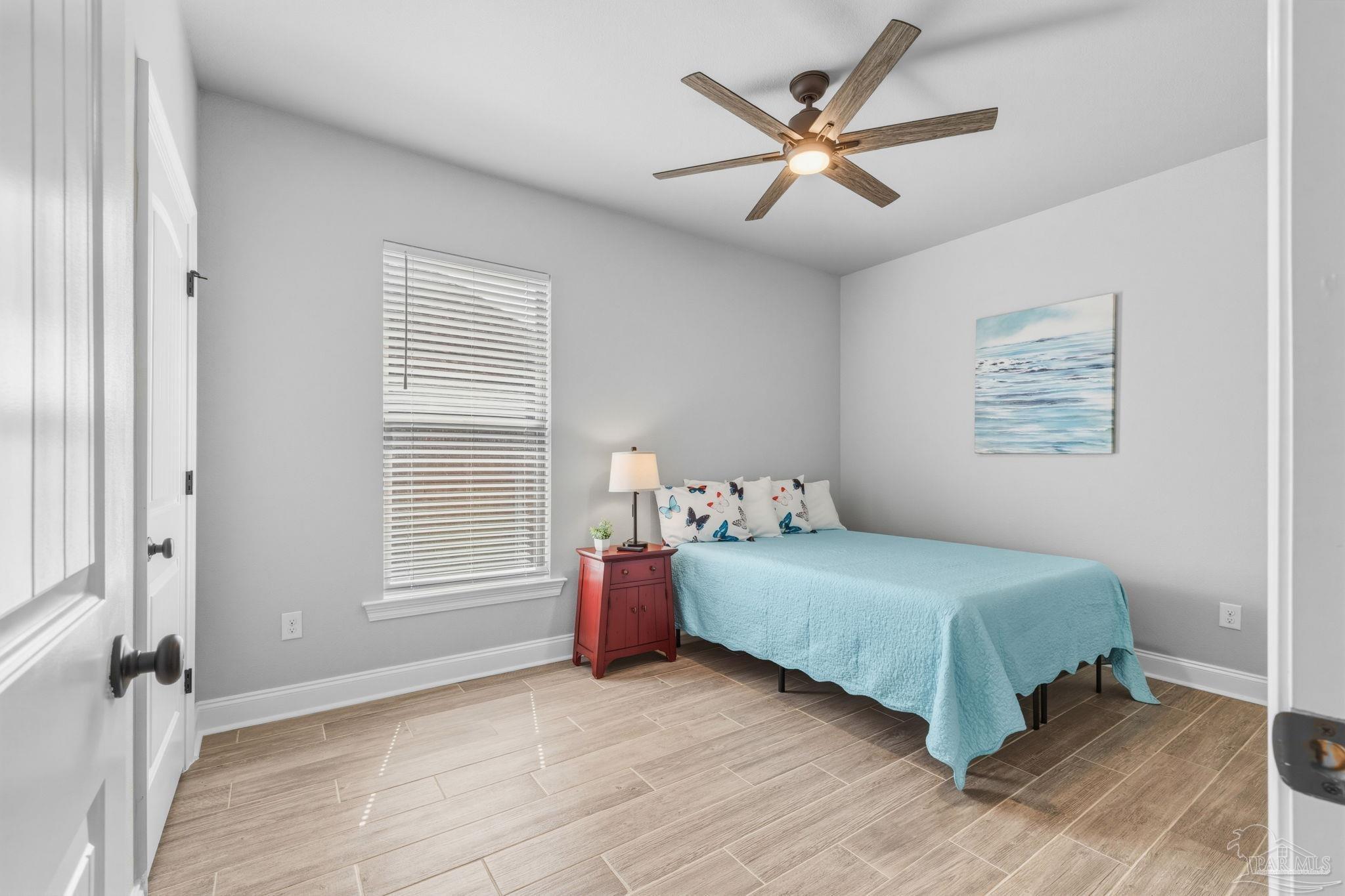 2129 Eagles Rdg Cove Cantonment, FL 32533 - Photo 35 of 66 a bedroom with a bed and a window