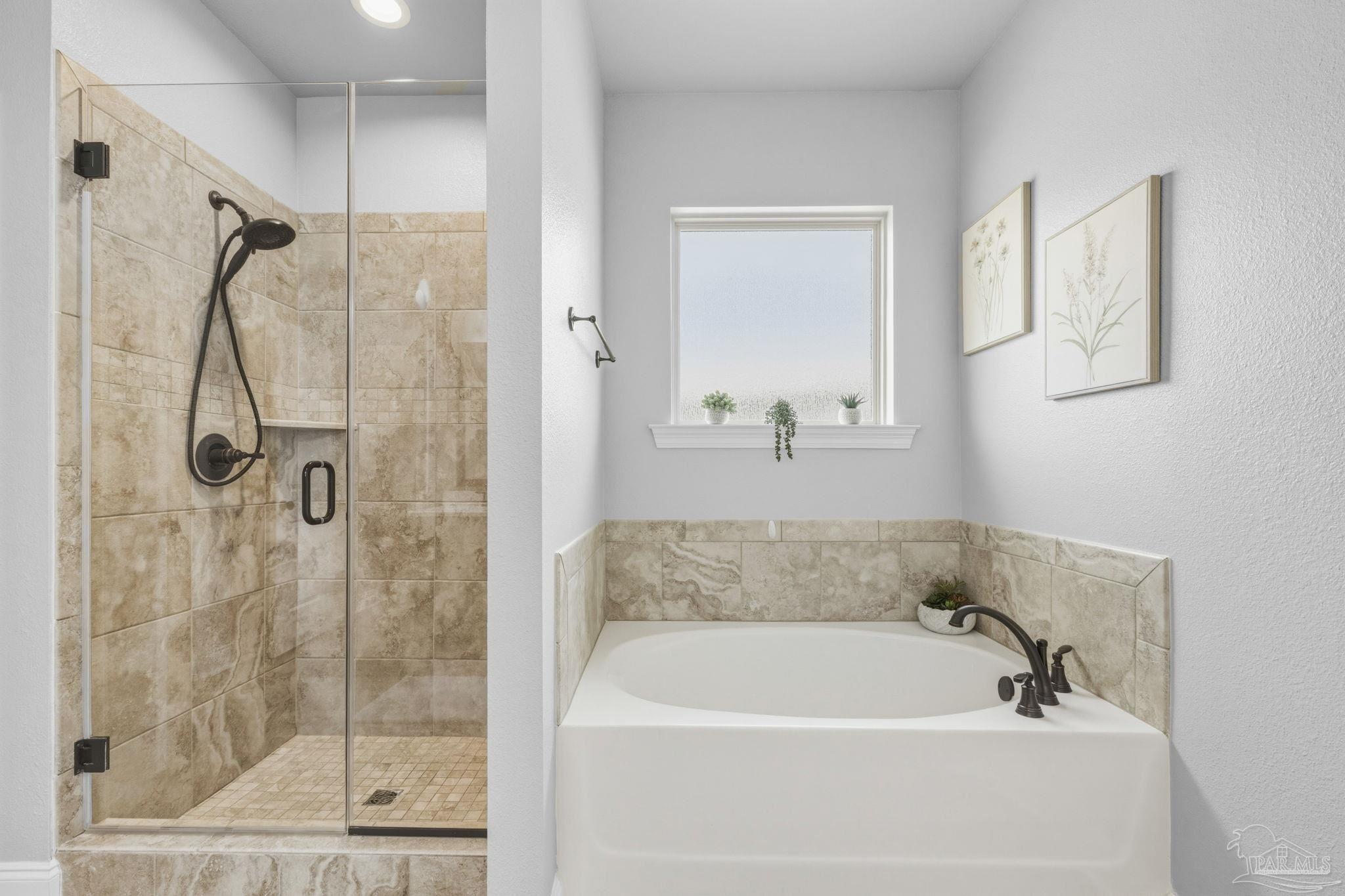 2129 Eagles Rdg Cove Cantonment, FL 32533 - Photo 41 of 66 a white bath tub sitting next to a shower