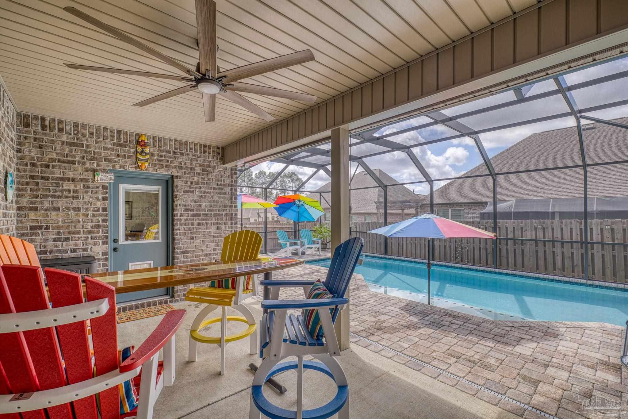2129 Eagles Rdg Cove Cantonment, FL 32533 - Photo 45 of 66 a view of a dining room with furniture and chandelier