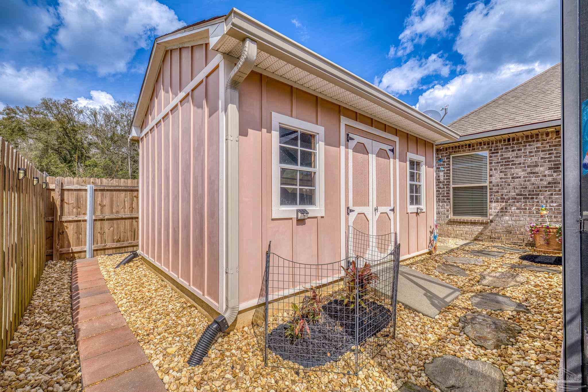 2129 Eagles Rdg Cove Cantonment, FL 32533 - Photo 55 of 66 a view of a house with backyard and deck