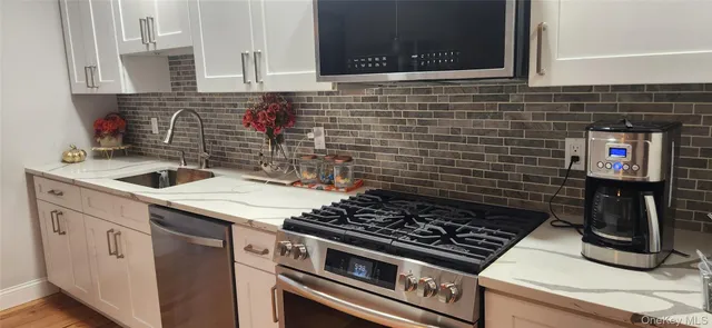 a kitchen with a stove and a sink
