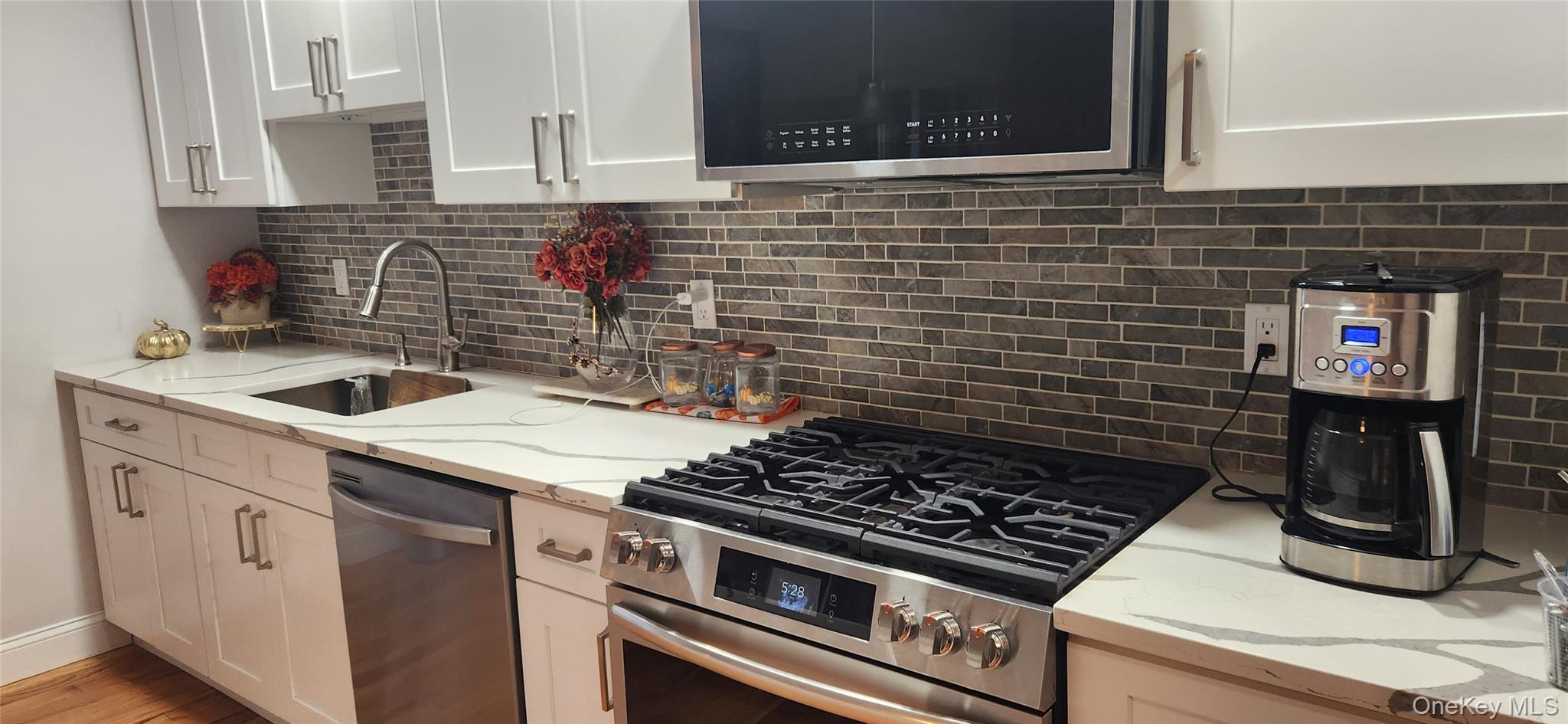 466 Granny Road Medford, NY 11763 - Photo 5 of 14 a kitchen with a stove and a sink
