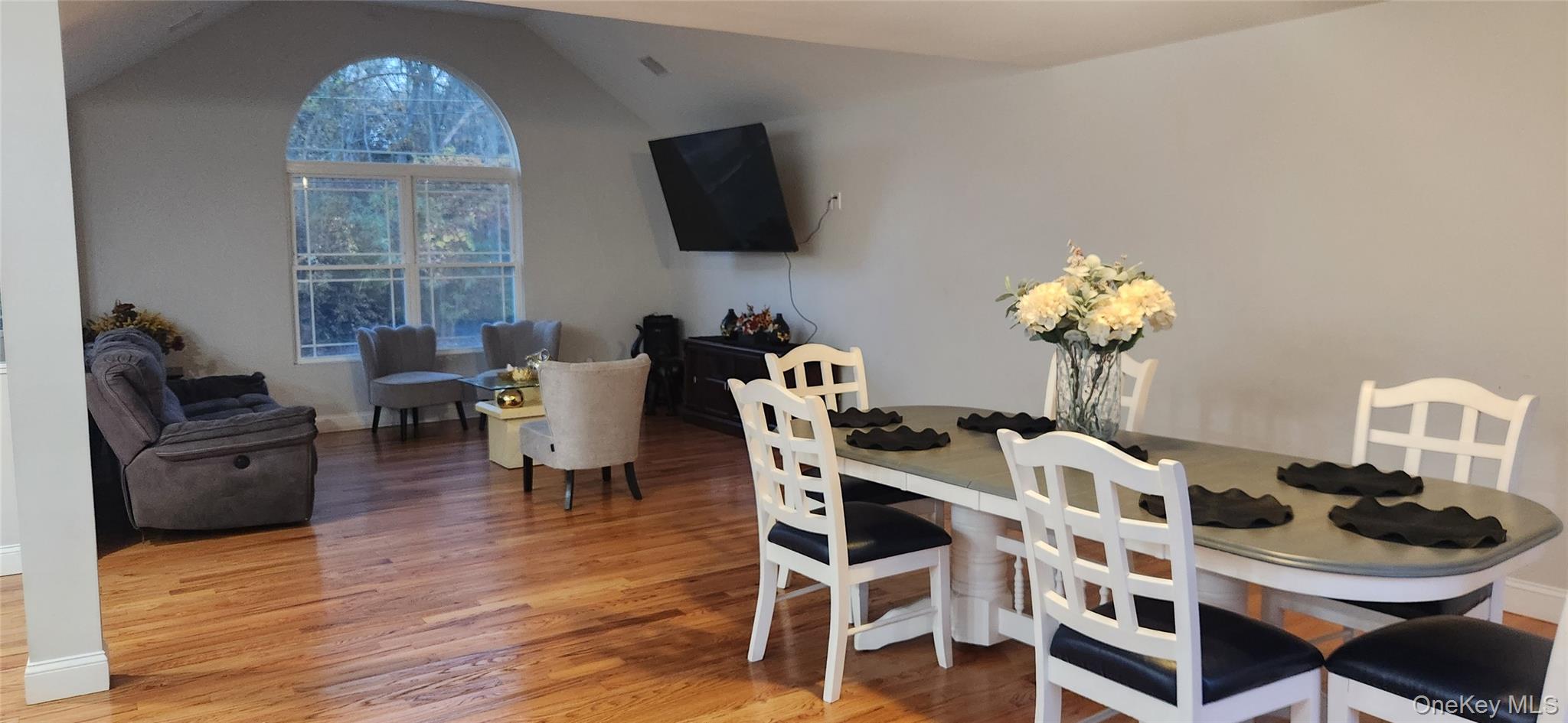 466 Granny Road Medford, NY 11763 - Photo 6 of 14 a dining room with furniture a window and wooden floor