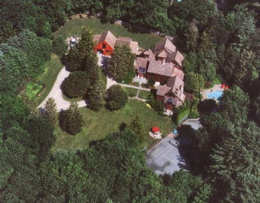 9 Sachem Road Weston, CT 06883 - Photo 1 of 1 an aerial view of waterside residential houses with outdoor space