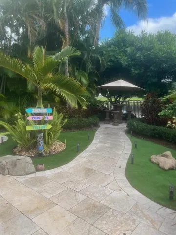 a view of a patio with table and chairs potted plants with wooden fence