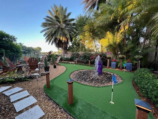 a view of a living room with fireplace furniture and a large window