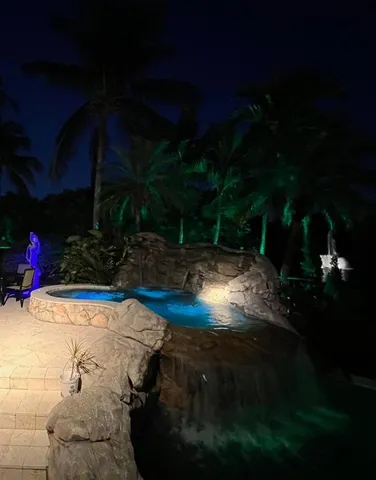 a room with lots of wooden furniture and windows