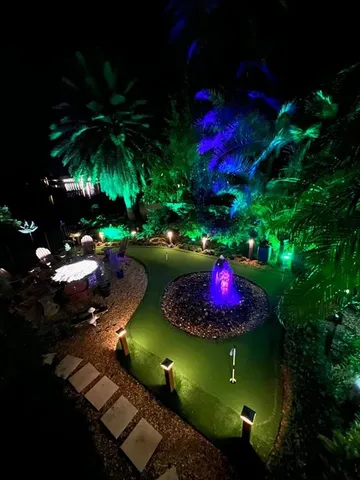 a kitchen with stainless steel appliances granite countertop a sink a stove a microwave a sink and cabinets