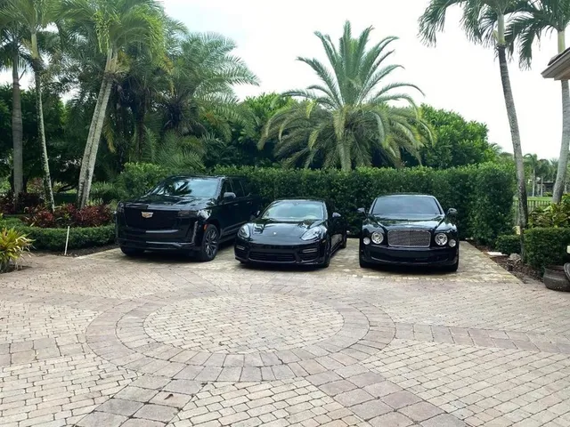 a couple of cars parked in a yard