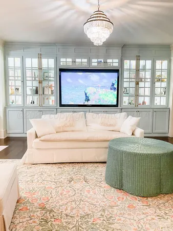 a large bathroom with a glass door shower and sink