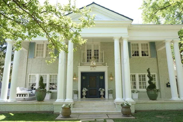 a view of a kitchen with kitchen island stainless steel appliances and living room view