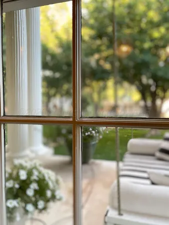 a kitchen with granite countertop white cabinets and a sink