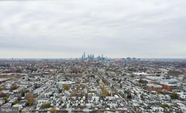 a view of a city with mountains in the background