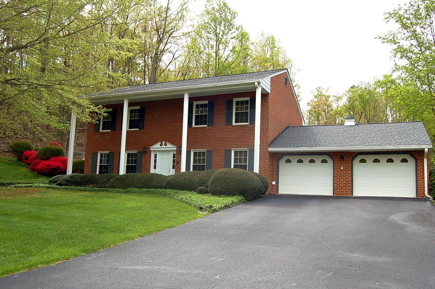 52 Ridgeview Road Blue Ridge, VA 24064 - Photo 1 of 46 a front view of a house with a yard and garage