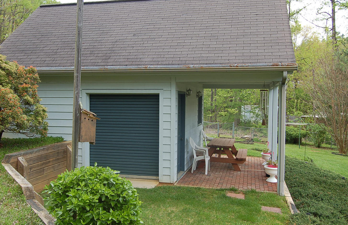 52 Ridgeview Road Blue Ridge, VA 24064 - Photo 38 of 46 a patio with table and chairs and potted plants