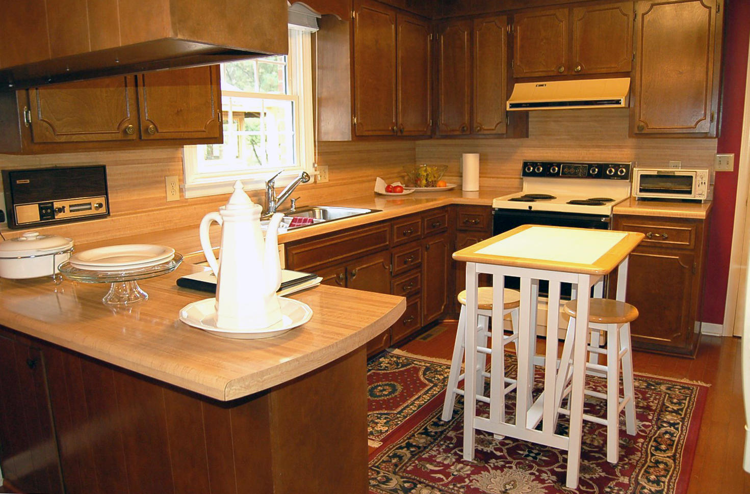 52 Ridgeview Road Blue Ridge, VA 24064 - Photo 6 of 46 a kitchen with a sink a stove and a microwave