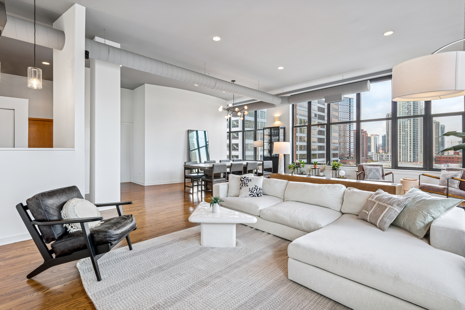 333 West Hubbard Street, Unit 801 Chicago, IL 60654 - Photo 5 of 24 a living room with furniture and a large window