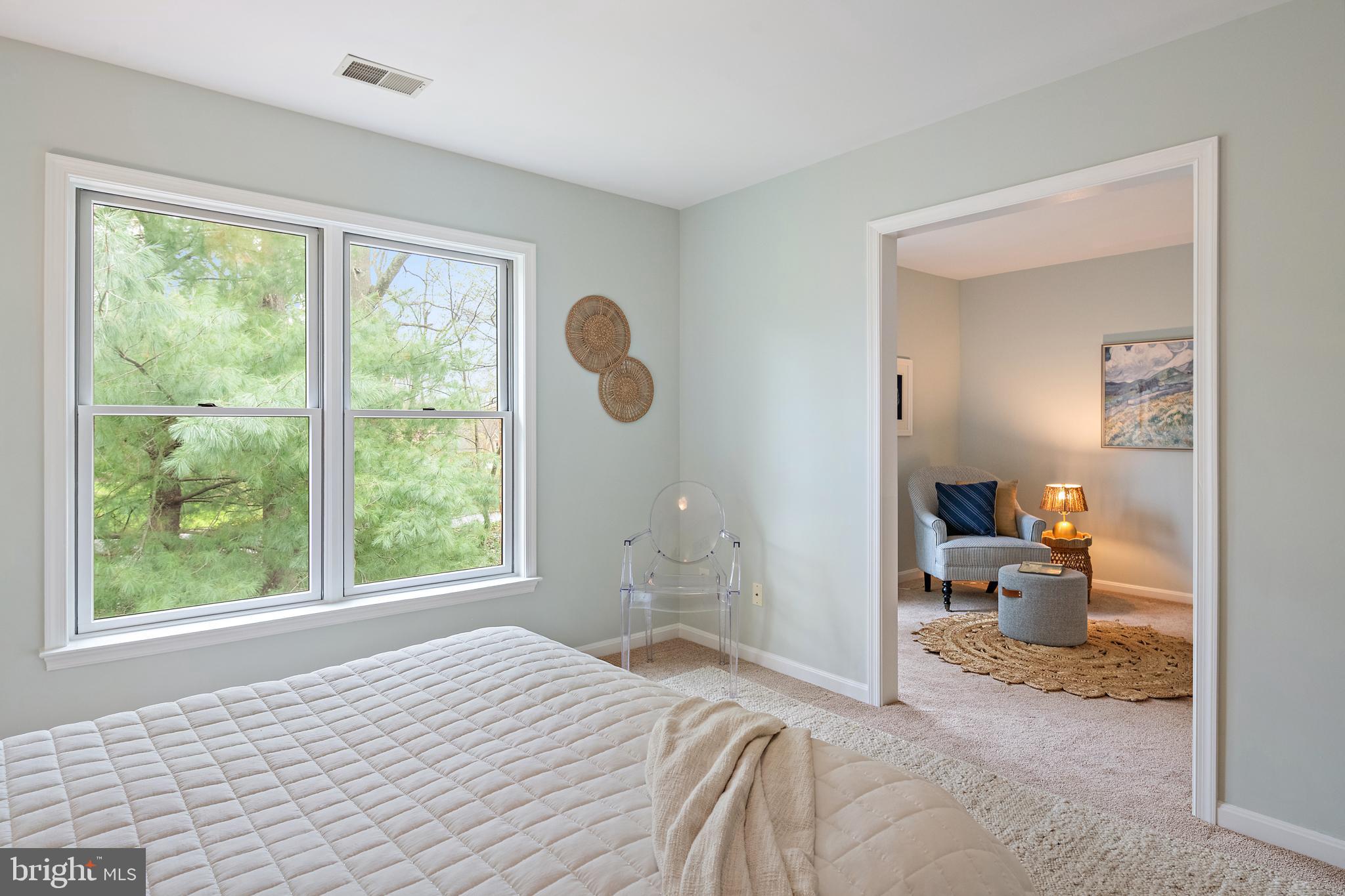 150 South River Landing Road Edgewater, MD 21037 - Photo 33 of 50 a bedroom with a bed and large windows