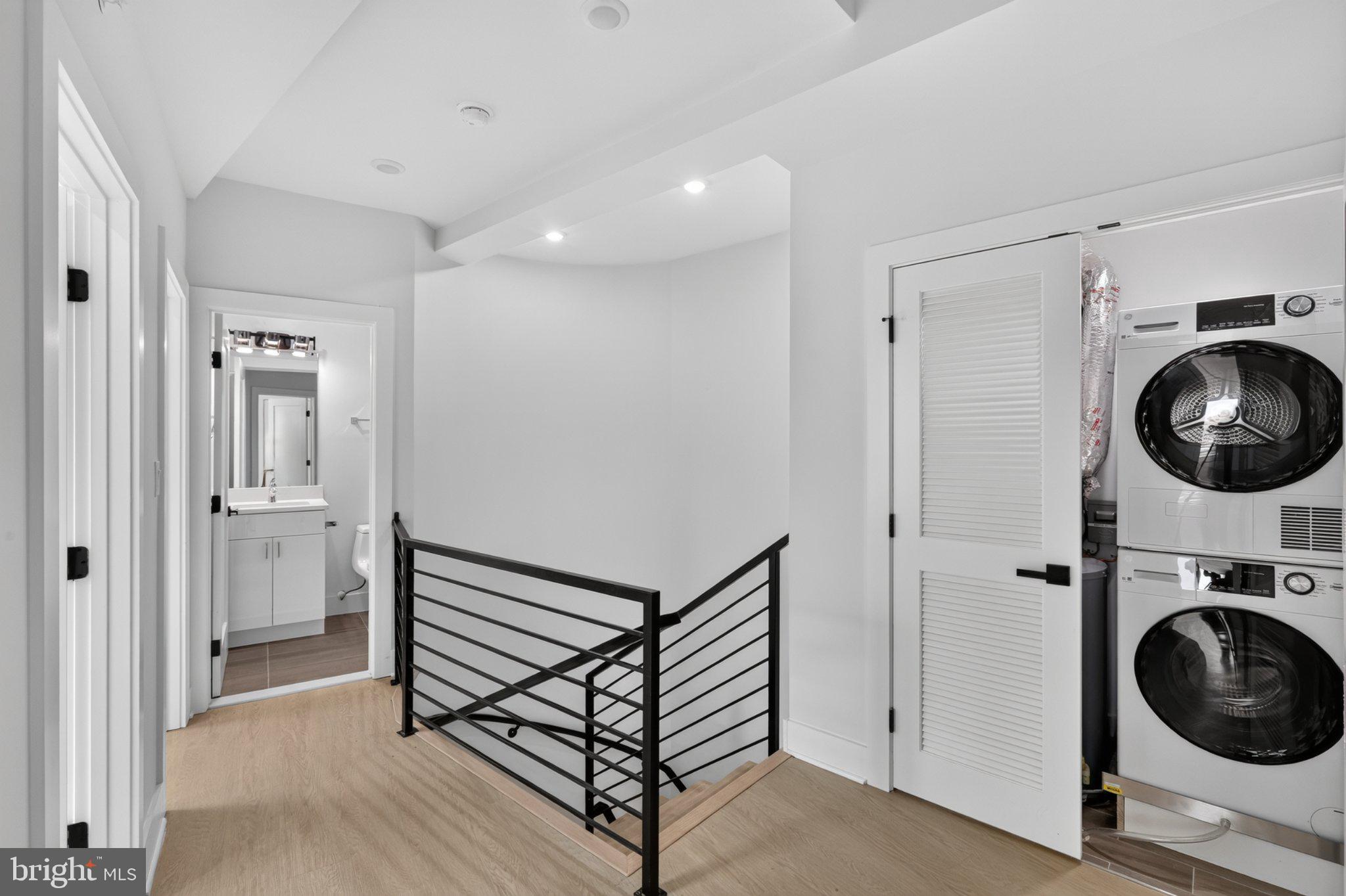 1650 Columbia Road Northwest, Unit 401 Washington, DC 20009 - Photo 9 of 21 Modern hallway with laundry nook.