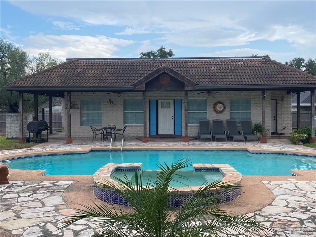 3702 North Glasscock Road Mission, TX 78573 - Photo 2 of 4 a view of a house with swimming pool patio and swimming pool