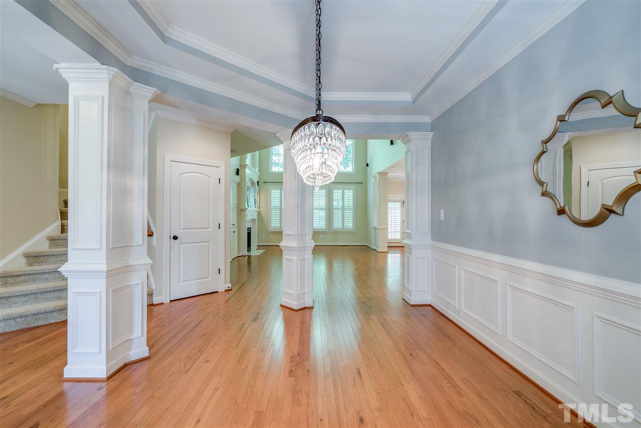 1016 Vino Drive Raleigh, NC 27607 - Photo 2 of 25 a view of a hallway with wooden floor