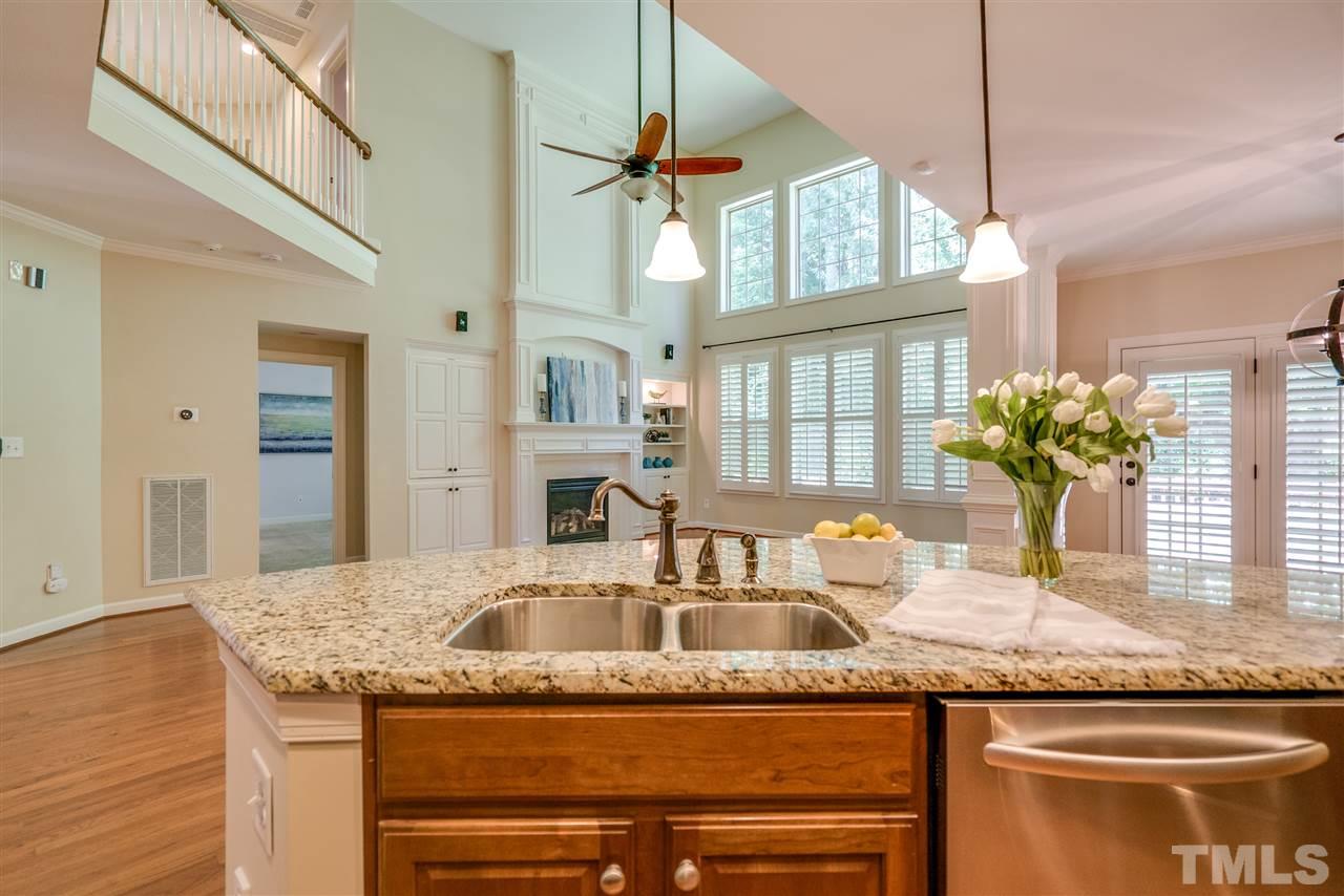 1016 Vino Drive Raleigh, NC 27607 - Photo 11 of 25 a kitchen with granite countertop a sink and a window